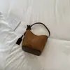 Bolso vintage de gran capacidad para mujer Shuai Mi Jia, nuevo modelo otoño 2026, bolso de hombro simple, bolso cruzado tipo cubo