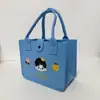 Bolsa de Fieltro Linda de Dibujos Animados Muñeco de Dibujos Animados Bolsa de Mamá Bebé 100 Días Banquete Boda Bolsa de Regalo de Cumpleaños