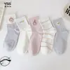 Calcetines para niñas Yishuangshuang, nuevos calcetines de otoño e invierno con forma de corazón de dibujos animados hasta la mitad de la pantorrilla, algodón peinado, calcetines estilo Miu con letras y caras sonrientes para estudiantes