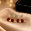 Aretes Geométricos Rojos Ankela Festivos de Año Nuevo Nicho Temperamento Venta Caliente Aretes de Botón Otoño/Invierno 2026 Venta al por Mayor de Pendientes