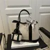Bolsa de Jardín de Lona de Gama Alta 2025 Nueva Bolso de Mujer de Color Contrastante Bolso de Hombro Casual para Viajar Bolso Tote Estilo Occidental