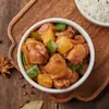 Pollo estofado con verduras congelado Guyan, paquete de 200 g para cocinar en tazón pequeño, ideal para llevar.