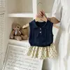 Conjunto de Verano para Niña 2026 Nuevo Estilo Coreano Bebé Dulce Casual Chaleco de Punto Azul Marino Falda con Estampado Floral