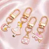 Colgantes de dibujos animados rosas lindos estilo coreano, dijes de aleación de esmalte de conejo y estrella, llaveros con anilla en D, accesorios para manualidades, venta al por mayor