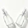 Botella Dispensadora Transparente Minimalista de 50 ml con Cierre a Presión y Cabezal de Bomba Spray a Prueba de Polvo, Botella de Vidrio Portátil para Viaje a Prueba de Luz para Agua de Rosas Pura