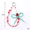 Cadena para Teléfono Móvil Llavero Colgante Pequeño Fresa de Cristal con Lazo Pulsera de Cuentas Colgante de Muñeca Moda para Mujer