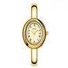 Relógio Pulseira GEDI Retrô Oval Dourado para Mulheres Números Romanos Mostrador Cravejado com Diamantes Leve Integrado Luxo de Nicho para o Dia a Dia Relógio de Quartzo
