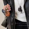 Collar Colgante de Corazón y Cruz de Cuero Maillard Cadena Larga con Borla para Suéter Diseño Dulce y Fresco Cadena para el Cuello