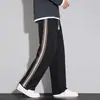 Pantalones casuales para hombre, nueva colección de otoño, caída retro, empalme de raya lateral, pantalones rectos holgados, pantalones deportivos de moda para hombre