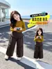 Pantalones de pierna ancha para niña Otoño 2026 Moda Nueva para Bebé Niña Dos en Uno Pantalones Casuales Pantalones a Cuadros para Niños Estilo Despeinado Hacia Atrás Modernos