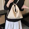 Bolsa transfronteriza 2026 primavera nuevo bolso de hombro tejido para mujer, mochila multifuncional de alta gama, moderno y versátil para ir al trabajo