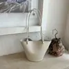 Bolso de cubo de nicho transfronterizo para mujer, nuevo bolso de mano versátil de moda 2026 con patrón de lichi, bolso de hombro cruzado