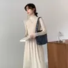 Otoño 2023 Nuevo elegante vestido suéter negro Francés manga larga base tejido vestido de punto mujer otoño e invierno