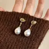 Pendientes de Perla Color Osmanthus Champagne Maillard 2025 Nuevo Estilo Caliente Pendientes de Otoño e Invierno Pendientes de Lujo Ligero de Alta Gama para Mujer