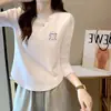 Camiseta de algodón acanalado de manga larga para mujer, nuevo estilo primavera/otoño, corte ajustado, diseño único, dobladillo curvo irregular, top de moda