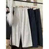 Foto real de los nuevos pantalones casuales de diseño otoño 2026 con cordón y cintura elástica, pantalones anchos holgados y versátiles para mujer
