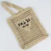 Nuevo bolso de mano tejido hueco transfronterizo para mujer, bolso de hombro, bolso de paja de verano, tote de gran capacidad, bolso de letras para vacaciones