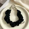 Suministro directo en stock de correa de muñeca para teléfono de algodón y lino con lunares suaves, llavero de scrunchie plisado con etiqueta de corazón