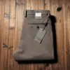 Pantalones de lana gruesa elástica para hombre de otoño e invierno 2023 pantalones de lana cepillada de alta gama rectos holgados de negocios casual