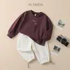 Conjunto de Sudadera con Capucha para Niños 2026 Nuevo Estilo Deportivo Estampado de Letras Parte Superior Color Sólido Pantalones Rectos Conjunto de Dos Piezas Moderno
