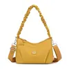 Bolsa transversal feminina 2026 novo estilo alta qualidade luxo leve nicho ombro único axila bolsa para ir ao trabalho versátil bolsa de mão bolsa pequena