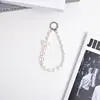 Cadena de muñeca para teléfono estilo Chanel con perlas, cadena colgante simple y exquisita, accesorio de llavero para coche de funda de teléfono para mujer