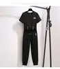 Conjunto Casual Deportivo de Manga Corta de Verano 2026 para Mujer, Conjunto de Dos Piezas con Top Holgado Corto Petite y Pantalones Cropped