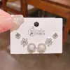 2025 Nuevos Exquisitos Pendientes de Flor y Perla de Alta Gama Set de Tres Pares Lujo Accesible Estilo Coreano Lujo Accesible Set de Pendientes Super Brillantes