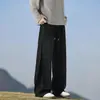Pantalones de chándal grises pesados de corte inclinado de marca moderna estilo americano para hombres y mujeres, corte holgado, adelgazantes, pantalones deportivos casuales de pierna recta de alta costura para otoño