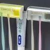 Estante de Almacenamiento a Prueba de Polvo para Cepillos de Dientes con Tapa Fabricante Estante de Almacenamiento sin Perforaciones para Lavabo de Baño Exprimidor Doble para Pasta de Dientes