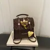 Mochila nueva de dibujos animados, diseño versátil de lunares, bolso bandolera de un solo hombro de moda 2026, estilo nicho para ir al trabajo, colección de otoño para mujer
