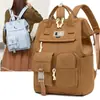 Mochila minimalista de color sólido estilo japonés con múltiples bolsillos para mamás, con almacenamiento en capas para que las madres lleven a sus bebés, adecuada para caminar y salidas, mochila versátil