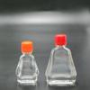 Suministro de fábrica viento 3ml7ml viento Esencia de Aceite botella de vidrio botella de aceite de flor roja botella de aceite activo cubierta de Esencia de Aceite de viento