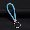 Llavero colgante de cuerda de cuero tejido de fábrica con cabeza de plástico para pareja, llavero de coche de cuero, colgante, accesorios, venta al por mayor
