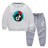 Conjunto de Roupas Infantis Estilo Coreano Novo para Primavera e Outono de 2026: Conjunto de Moletom e Calça Longa Infantil, Roupa de Algodão com Manga Longa Tiktok