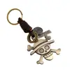 Llavero de cuero genuino con calavera de aleación tejida vintage, directo de fábrica, joyería punk, llavero de piel de vaca