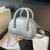 Versión coreana de popular bolsa de almohada portátil de nicho popular 2024 nueva moda casual para mujer bolso de hombro cruzado