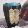 Recolección Transfronteriza de Pendientes Metálicos con Hojas Geométricas Escarchadas, Ganchos para Orejas Creativos Personalizados con Borla de Hoja Redonda Hueca