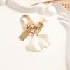 Chaveiro Flor de Pérola Imitação Cruzada Laço Franja de Pérola Pingente de Carro Chaveiro Feminino Pingente de Bolsa