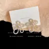 Pendientes de pétalos huecos temperamento femenino elegante exagerados dulces simples delgados cara redonda pendientes de flor una generación de cabello
