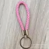 Llavero de cuerda de cuero trenzado simple creativo colgante de muñeca linda accesorios de llave para parejas tendencia regalos pequeños venta al por mayor