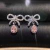 Transmissão ao vivo fornecimento luz de luxo elegante arco rosa diamante brincos grupo de luxo embutido gota de água colorido diamante amarelo zircão brincos