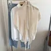 Chal de punto de lana de alta gama con diseño de triángulo hueco para mujer, otoño, versátil, tacto de alta gama, bufanda tipo chal con borlas, calentador de cuello