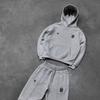 Otoño e Invierno 2025 Nueva Marca de Moda Patrón Bordado Estilo Callejero de Moda Sudadera con Capucha Personalizada Conjunto Casual de Pantalones