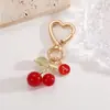 Amazon versión coreana de llavero con letras de cereza colgante accesorios para bolso aleación DIY cerezas colgantes venta al por mayor