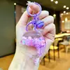 Nuevo llavero de muñeca de delfín con arena movediza relleno de aceite, colgante para mochila, decoración para bolso de pareja, regalo pequeño para venta al por mayor