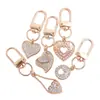 Lujo Ligero Chapado en Oro Full Diamante Charm Hebilla en Forma de D Colgante Hueco en Forma de Corazón Accesorios para Bolsos Llaves Fábrica Stock Mayorista