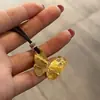 2026 Llamativo Lujoso Collar con Borlas Cadena Dorada Hueca para Clavícula Elegante Colección de Alta Gama Collar Flor de Iris