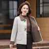 Elegante y moderno abrigo de lana para madre de mediana edad con botones de rana para mujer, versátil estilo nuevo de otoño e invierno, abrigo de lana de doble cara de corte ancho