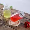 Botella gorda roja de 550 ml Botella para té con leche de red Botella para llevar Botella de PP resistente a altas temperaturas Yang Zhi Ganlu
